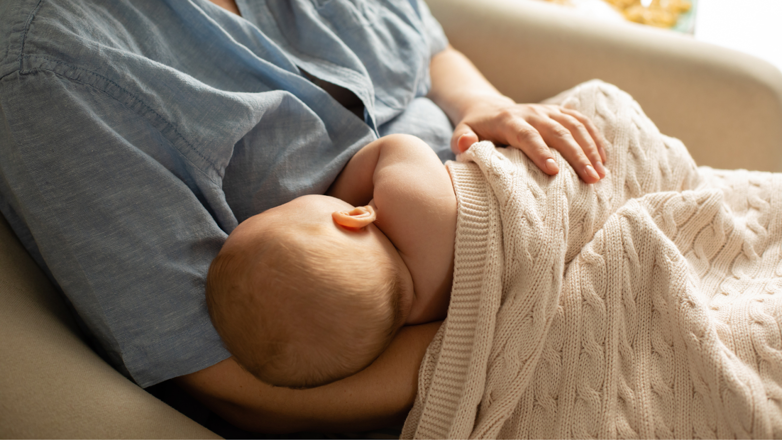 A Mother Gently Breastfeeding