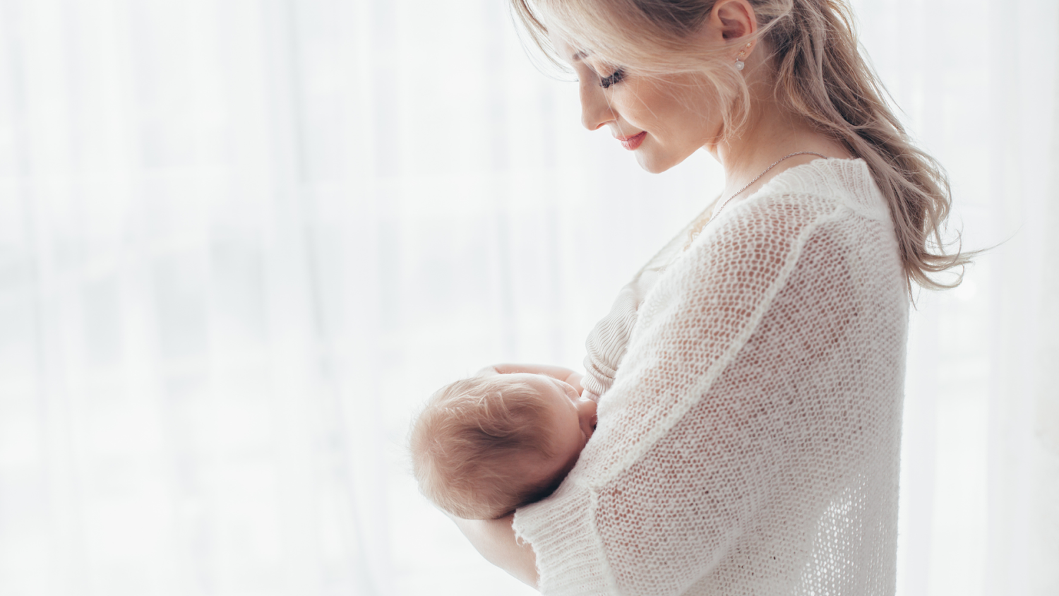 A Mother breastfeeding Her Newborn