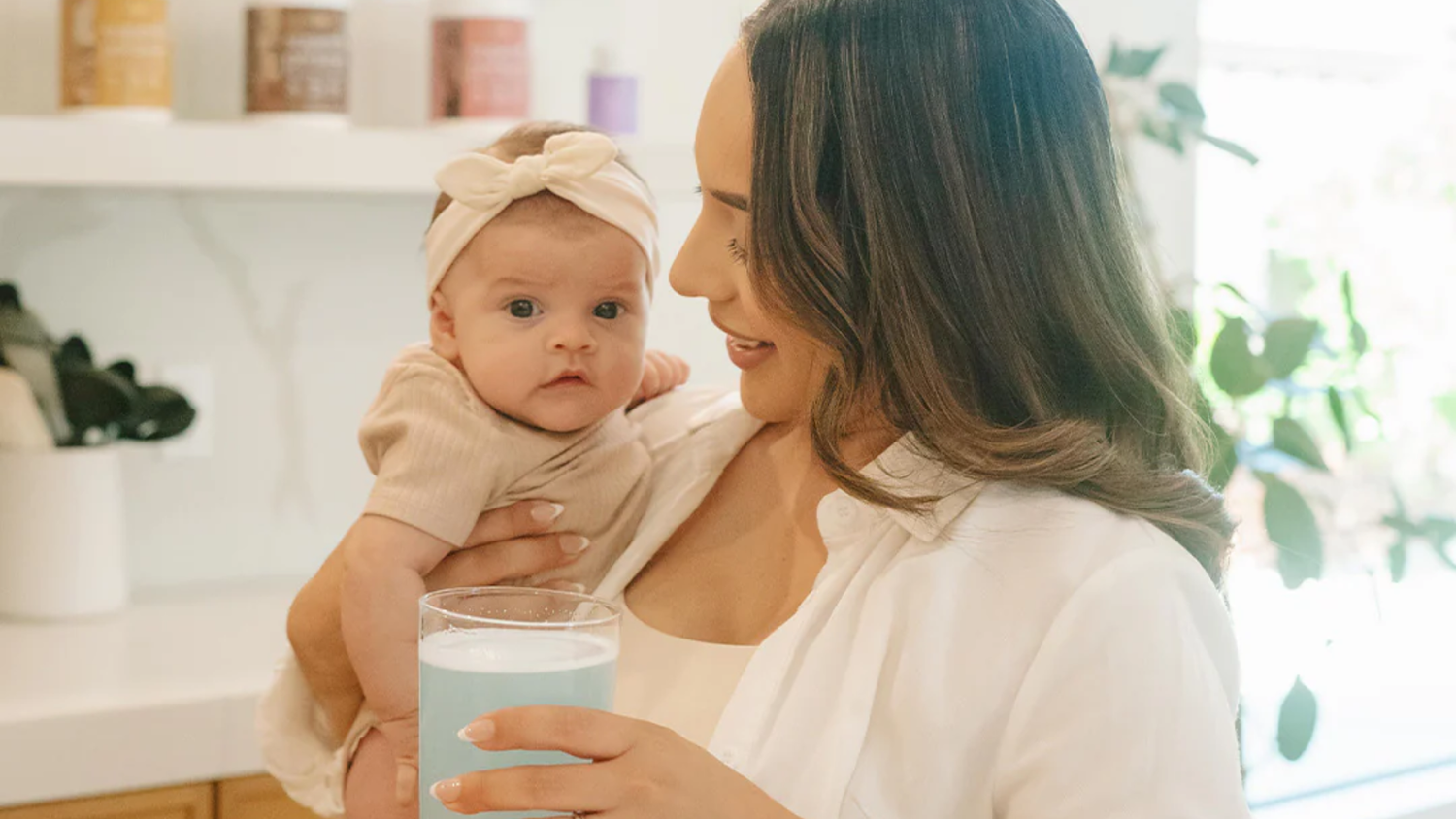 A mother holding her newborn baby 