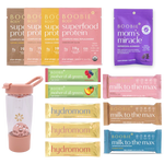 Assorted Boobie* Superfoods products including protein packages, gummies, and bars on a white background.