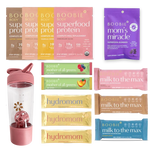 Assorted Boobie* Superfoods products including protein packages, gummies, and bars on a white background.