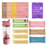 Assorted Boobie* Superfoods products including protein packages, gummies, and bars on a white background.