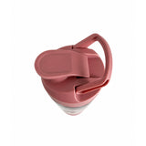 Pink silicone lid on a clear container with a white background
