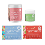 Boobie Superfood Protein, Mother of All Greens, Hydromom Hydration + Energy Drink Mix packaging on a white background